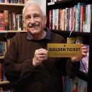 Craig holding a Golden Ticket for a year of free audio books