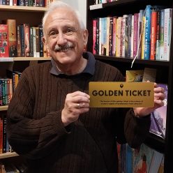 Craig holding a Golden Ticket for a year of free audio books